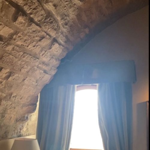 view of stone arch in room